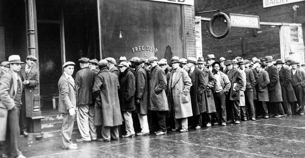 Unemployed men queued outside a depression soup kitchen in Chicago